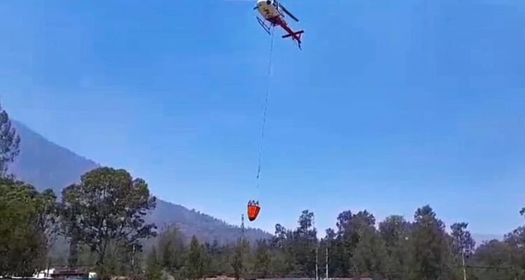 Water-Bombing Helicopter Deployed to Extinguish Forest and Land Fires at Kawah Ijen