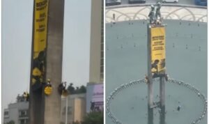 Greenpeace Activists Scale Welcome Monument in Jakarta, Unfurl Banners Demanding Climate Action and Lower Living Costs